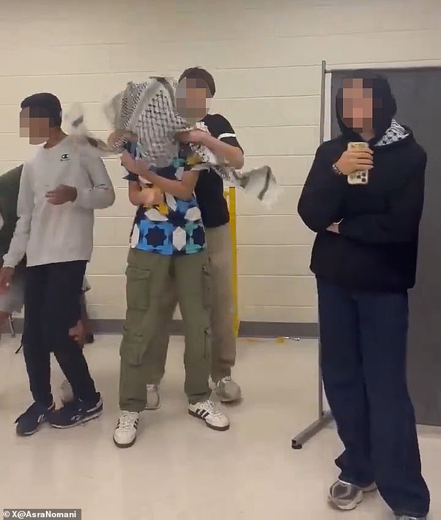 Several Muslim teens at one of Virginia¿s elite high schools were suspended after staging an 'antisemitic' skit where a student wrapped a keffiyeh around a classmate¿s head and pretended to kidnap him (pictured)