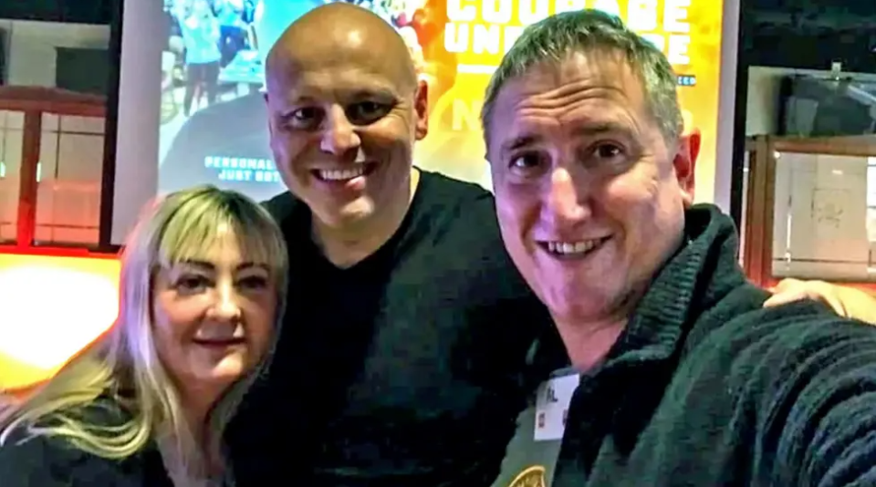 Joshua Saunders with a man and a woman.