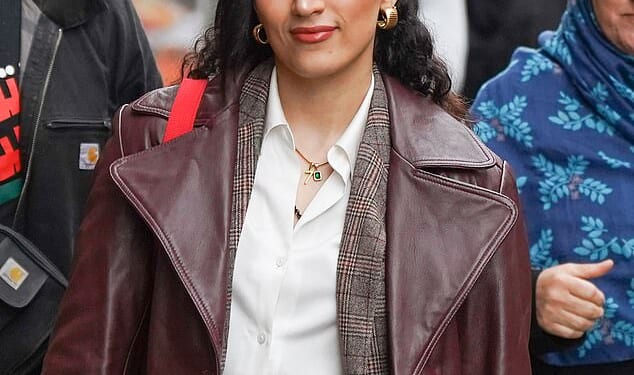 An NHS junior doctor who vowed she 'would never condemn' the October 7 Hamas attacks has today arrived at her tribunal wearing a necklace with a distinctive gold charm showing the number 'seven'