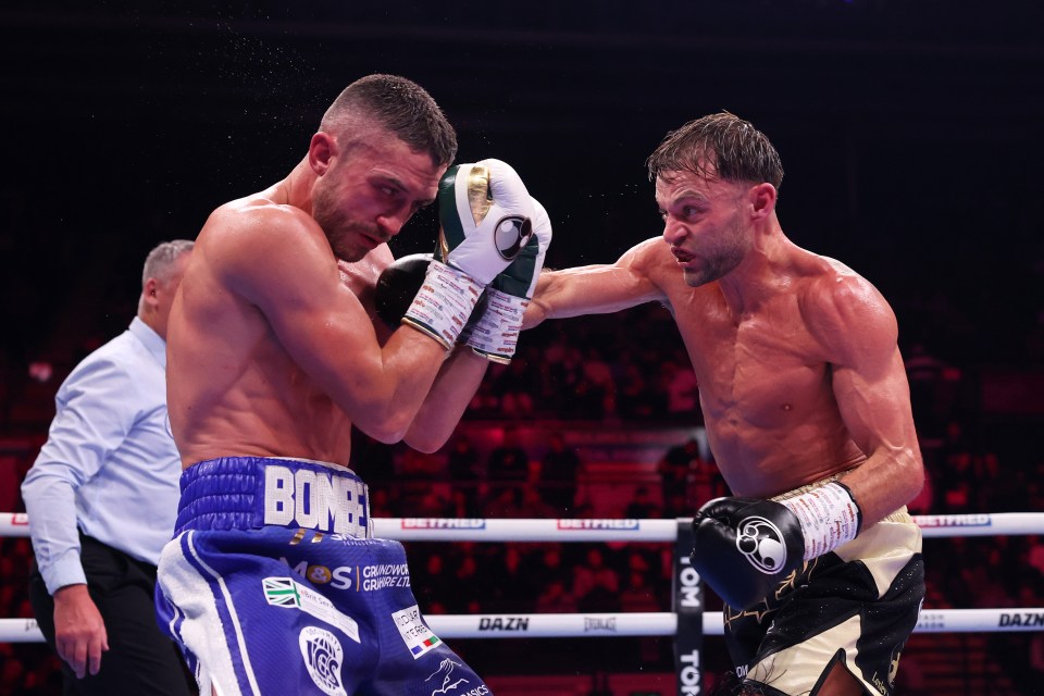 Josh Padley punches Reece Bellotti during their super featherweight fight.
