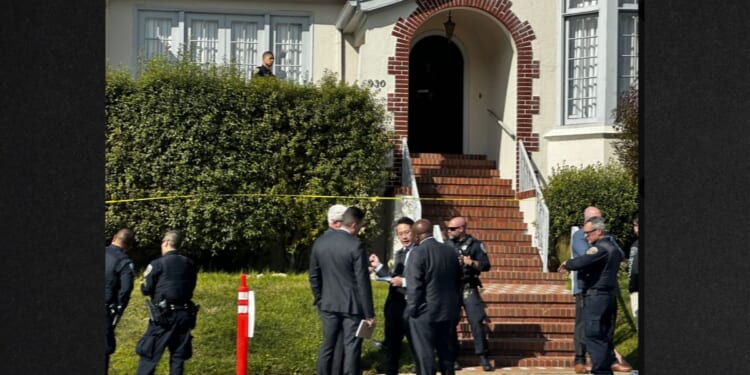 Investigators gather outside a San Francisco home where four bodies were found, including two children.