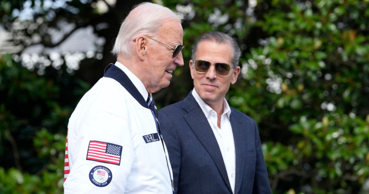 Then-President Joe Biden, left, and Hunter Biden. right, walk toward Marine One on the South Lawn of the White House in Washington, D.C., on July 26, 2024.