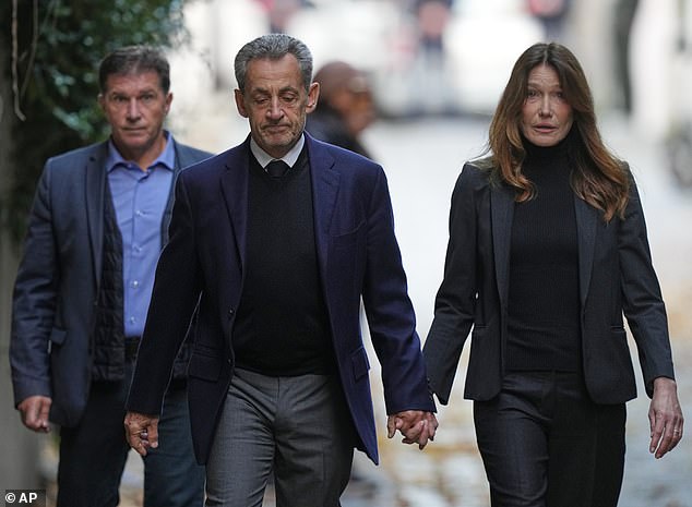 Former French President Nicolas Sarkozy and his wife Carla Bruni-Sarkozy left their Paris home on Tuesday as he went to prison to serve time for a criminal conspiracy to finance his 2007 election campaign with funds from Libya