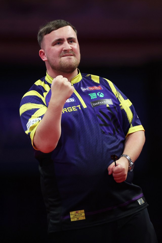 Luke Littler of England celebrates during the Final match.