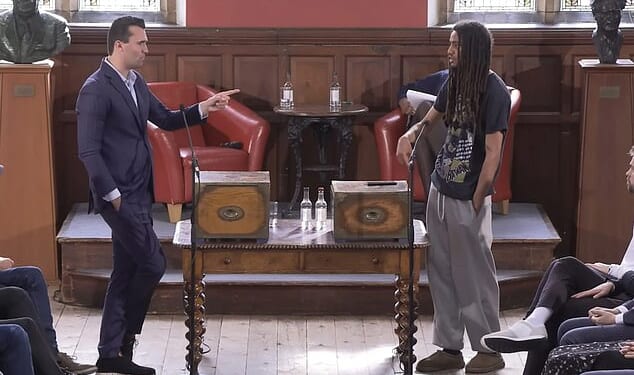 The Oxford Union president who celebrated Charlie Kirk’s shooting could be ousted this Saturday after a poll on his future was opened up to tens of thousands of proxy voters from around the world. Pictured: Charlie Kirk (left) debates with George Abaraonye (right) at the Oxford Union in May 2025