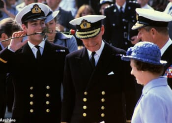 Prince Andrew jokes around next to Prince Philip after returning from the Falklands in 1982