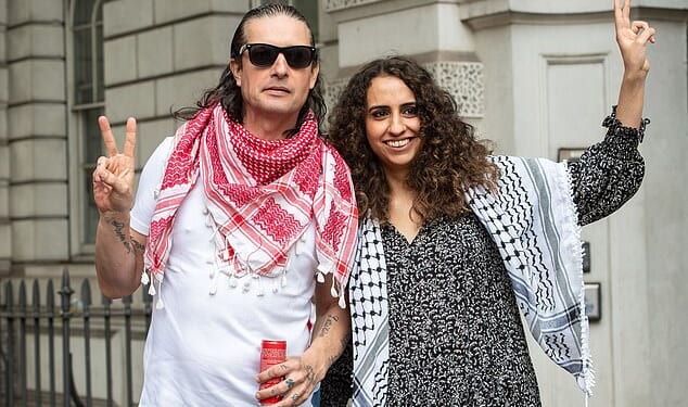 Palestine Action co-founders Richard Barnard and Huda Ammori, pictured in 2023 - Ms Ammori has won the latest stage in a court battle to challenge the group's proscription as a terrorist organisation