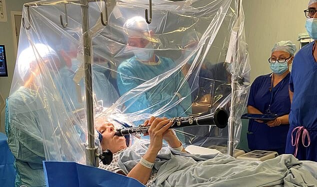 Denise Bacon, 65, experienced instant improvement in her finger movements as the doctors stimulated her brain with an electrical current