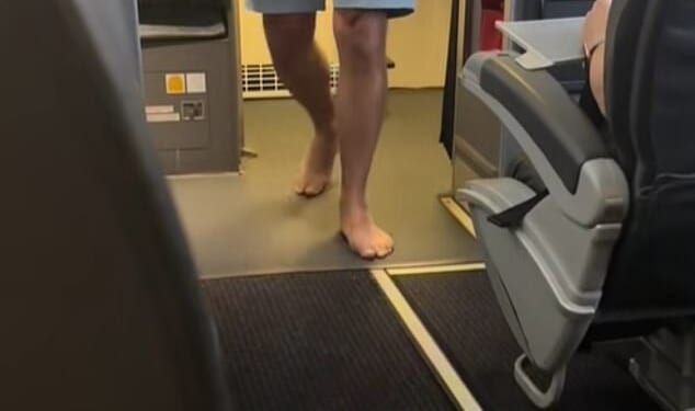 Natalie Buffett, who goes by @nataliebuffett on TikTok, shared an eight-second clip to her page in July, which briefly captured a male passenger - without socks or shoes - exiting the restroom at the front of the plane