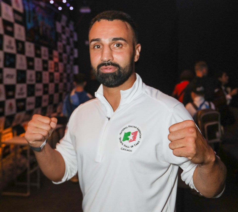 Paul Malignaggi poses for a picture after a press conference.