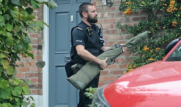 Police remove firearms from the family home of an Oxford University student who was arrested for 'inciting racial hatred' after he led chants of 'put the Zios in the ground'
