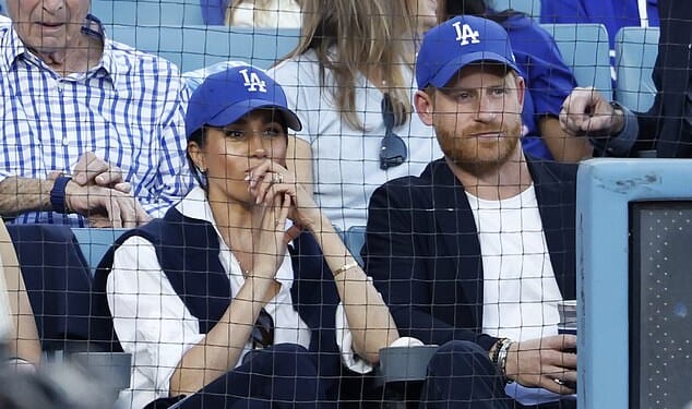 Prince Harry and Meghan Markle appeared closer than ever as they stepped out for a baseballl match in California last night