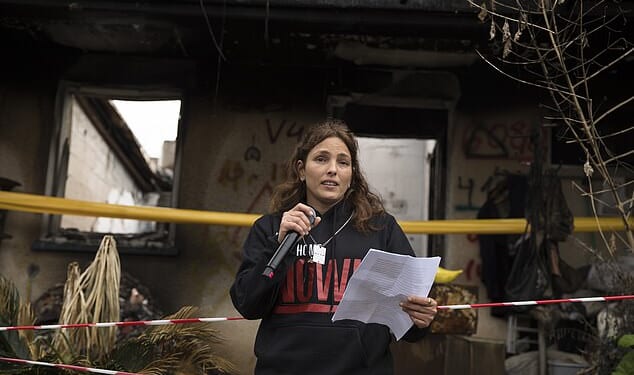 Amit Soussana who was held hostage by Hamas and released speaks to the press near her house where she was kidnapped during the Oct 7 attack on the kibbutz, on January 29, 2024 in Kfar Aza, Israel