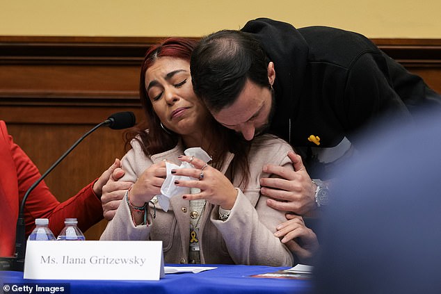 Ilana Gritzewsky is comforted after speaking about her experiences as a hostage during a discussion with the House Foreign Affairs Committee on February 12, 2025 in Washington