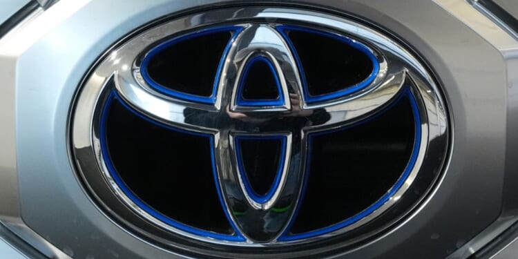 A Toyota logo is seen on a Toyota Tundra HV 4x4 at the Pittsburgh International Auto Show in Pittsburgh, Pennsylvania, on Feb.15, 2024.