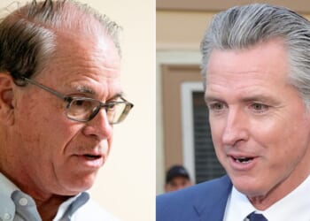 Indiana Gov. Mike Braun, left, seen in a file photo from November 2024, said his action is intended "to protect Hoosiers from efforts in other states that seek to diminish their voice in Washington" -- a reference to states like Gov. Gavin Newsom's California, which has revised its congressional map to increase the number of Democrats sent to Washington.