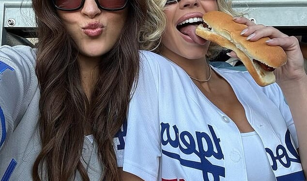Sydney Sweeney had a cheeky moment with a hot dog as she posed for fun snaps at the LA Dodgers game on Tuesday