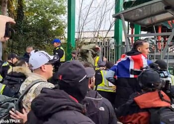 The anti-immigration protest erupted after an onlooker reportedly threw a bottle into the crowd