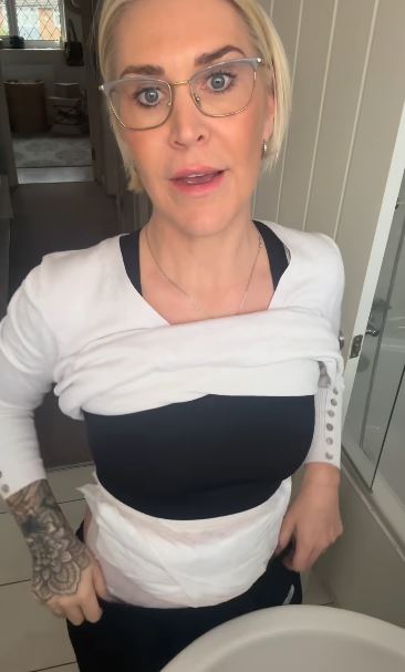 Jo O'Meara from S Club wearing a white bandage around her midsection.