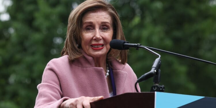 Rep. Nancy Pelosi speaks during a rally opposing House Republicans Tax Proposal prior to the final House Vote on Capitol Hill in Washington, D.C., on May 21.