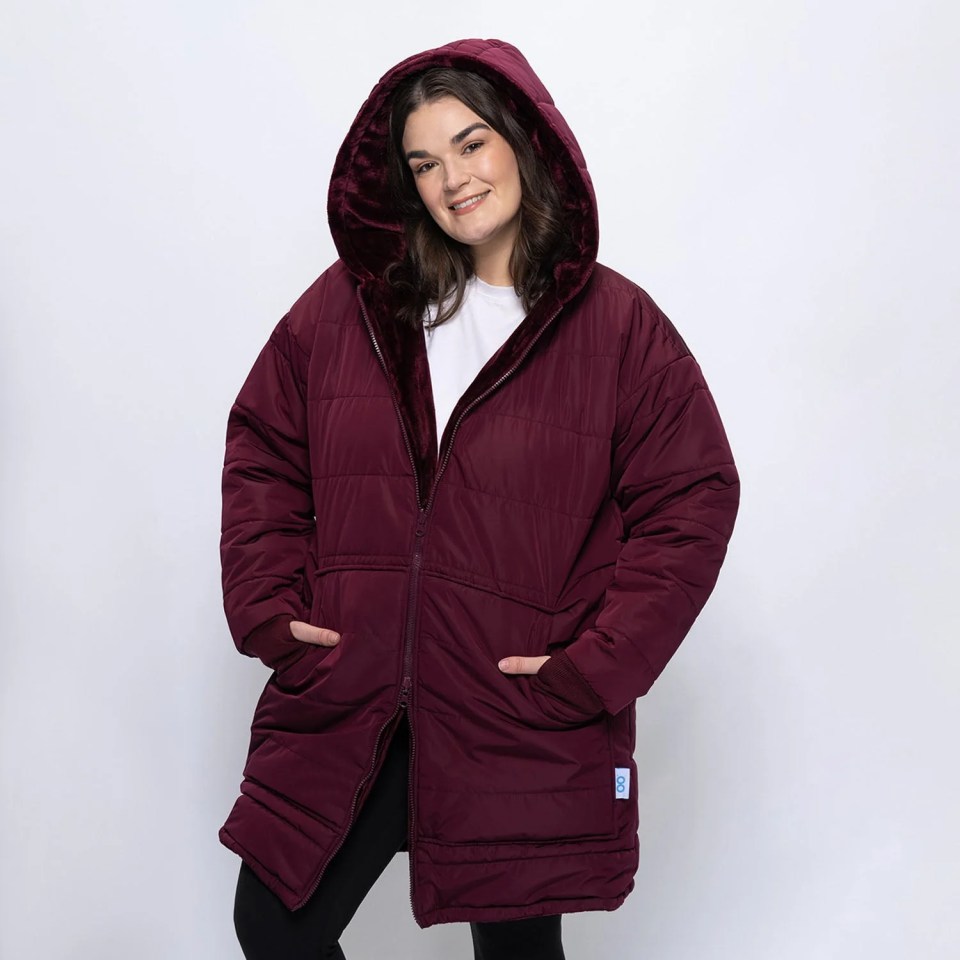 Woman models the Burgundy OutdoorOodie.