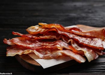 Experts warn that failure to ban nitrites from bacon and ham despite sounding alarm a decade ago has cost thousands of lives
