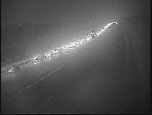 Heavy traffic at night on the M6 motorway.