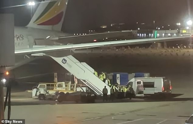 Footage captured from Heathrow Airport showed the moment Kebatu, 38, was escorted on to a plane last night