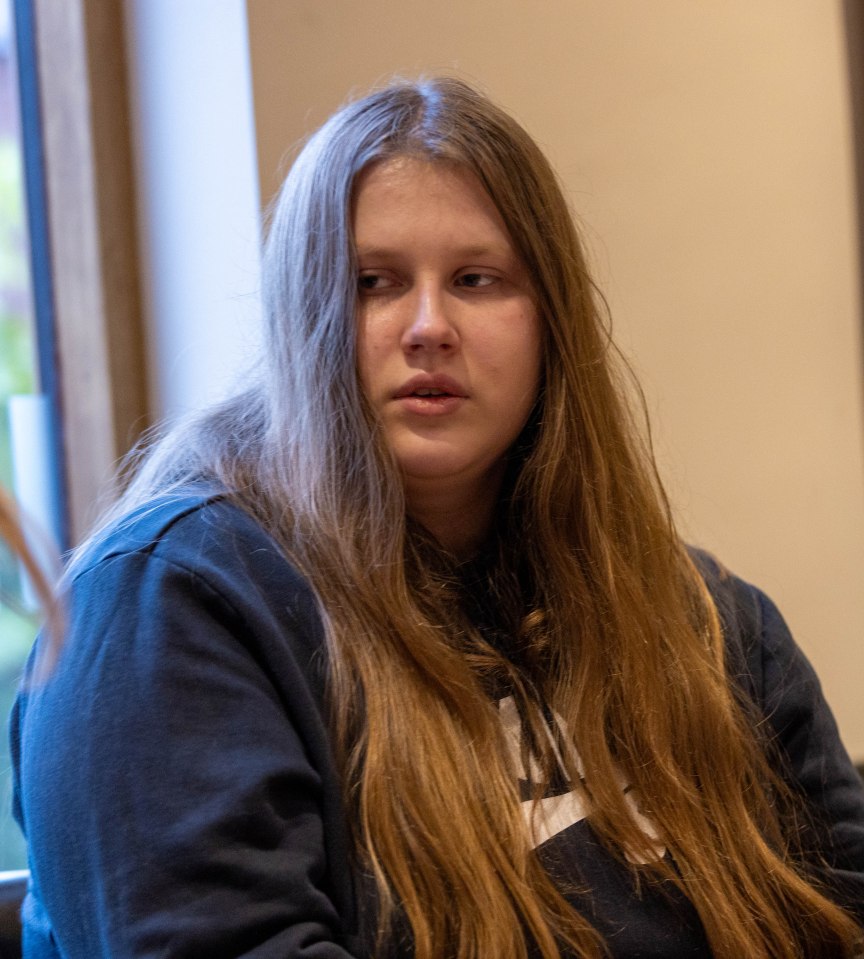 Julie Wendelt, a woman with long light brown hair, looking to the left.