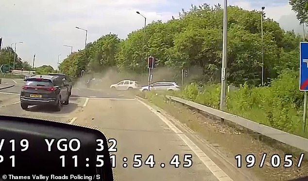Instead of stopping at the lights, Marshall, from Worthing in West Sussex, hits the accelerator to change lanes and ploughs into another motorist