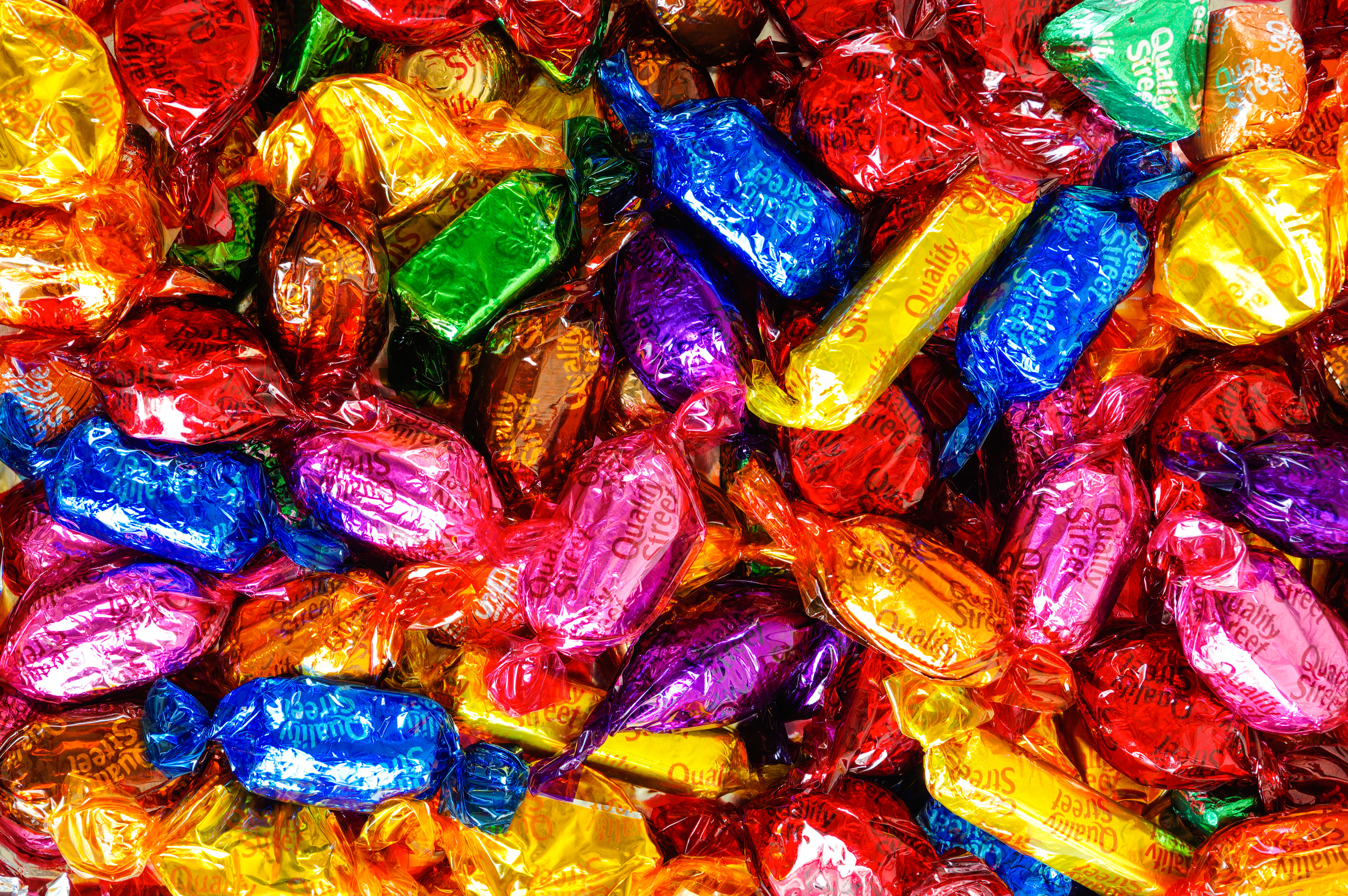 Quality Street chocolates in various colorful wrappers.