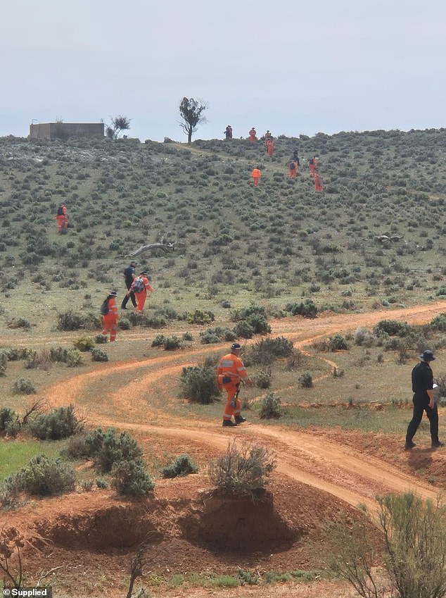 Police searched  the 60,000ha property shortly after Gus disappeared but found no sign of the little boy (pictured, volunteers at the property)