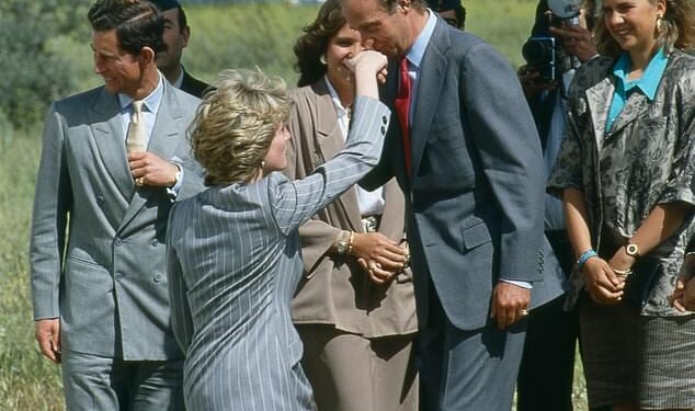Princes Diana (pictured, left) curtseys to King Juan Carlos of Spain, who kisses her hand, as she and Prince Charles (left) leave Toledo after an official visit to Spain, April 25 1987