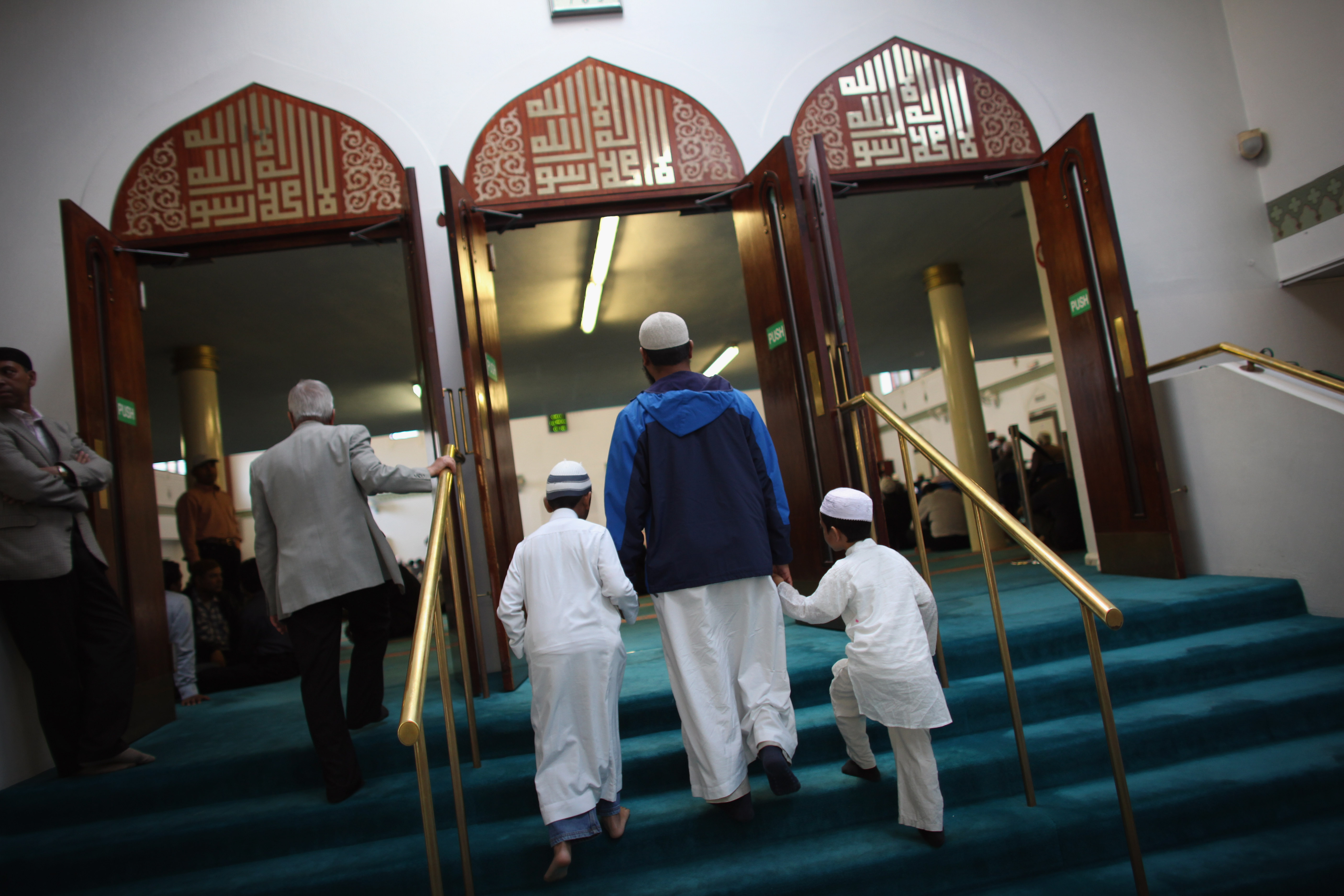 Muslim men and boys arriving to pray before Iftar at the London Muslim Centre.