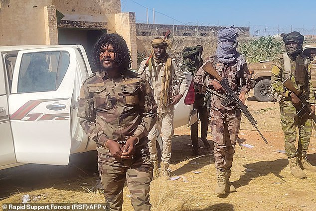 Pictured: The moment Abu Lulu - whose real name is Brigadier General Al-Fateh Abdullah Idris was arrested