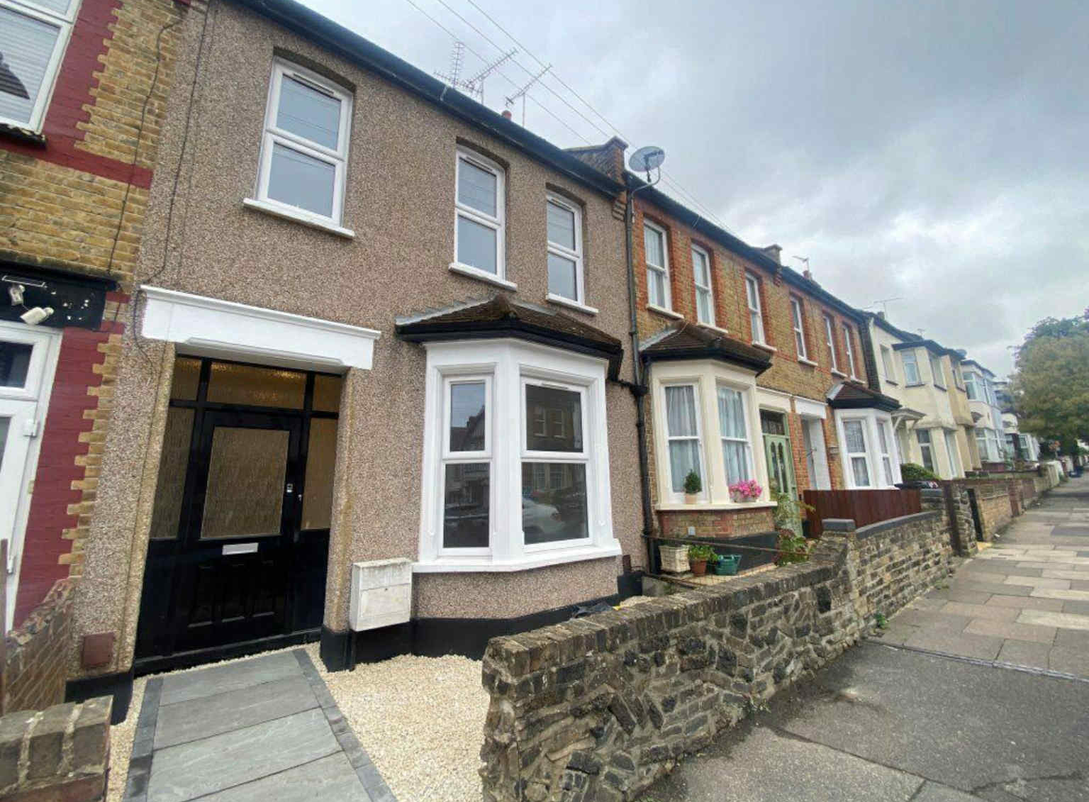Row of terraced houses on a street.