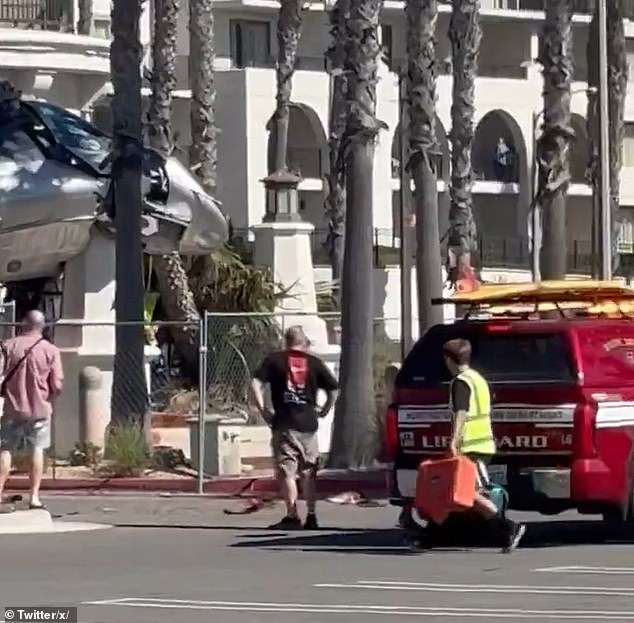 According to initial reports, the aircraft appeared to suffer a 'tail rotor failure' before plummeting from the sky and slamming into the Hyatt Hotel, crushing several palm trees outside