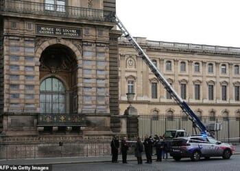 The world-famous Louvre museum in Paris was hit by a gang who stole jewellery worth millions (pictured: French police officers next to a ladder propped up against the tourist site)
