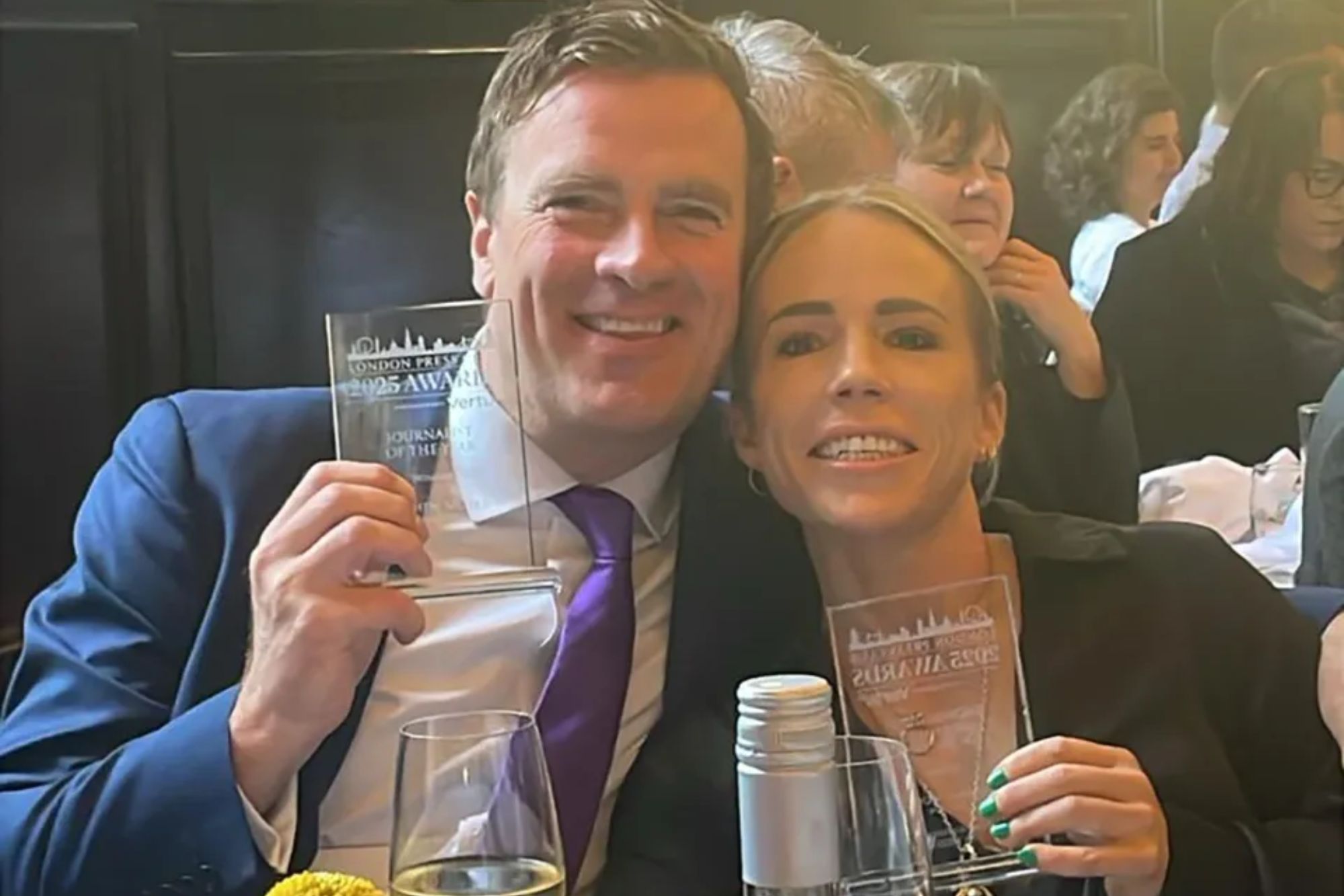 An image collage containing 1 images, Image 1 shows Stephen Moyes and Clemmie Moodie holding their Journalist of the Year and Showbiz Journalist of the Year awards at The London Press Club Awards