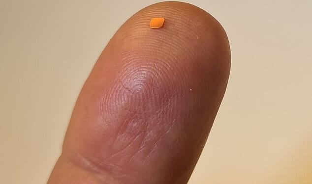 Measuring just 2mm x 2mm, the 'pioneering' implant is paired with a special pair of augmented reality (AR) glasses, equipped with a camera