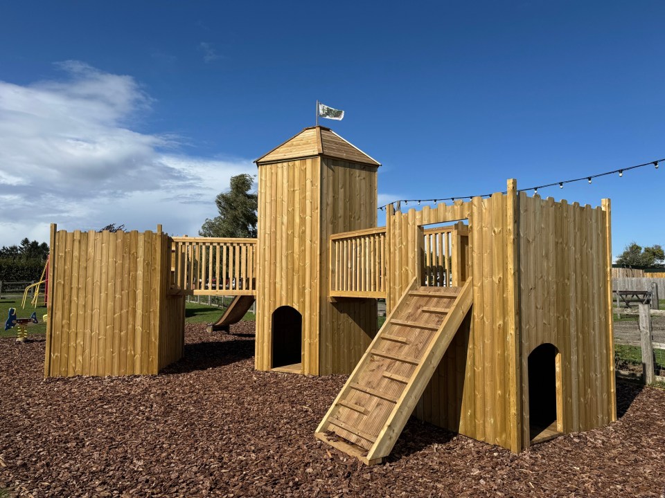 Wooden castle playground structure at Jack's Yard, Fairytale Farm.