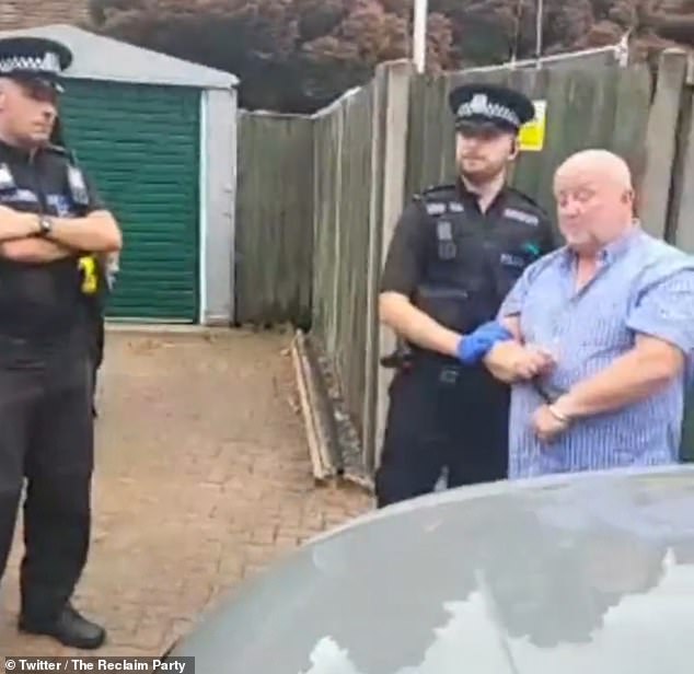 This is the moment army veteran Mr Brady (pictured) was arrested by Hampshire Police for 'causing anxiety' after retweeting a picture of a swastika made out of Pride flags
