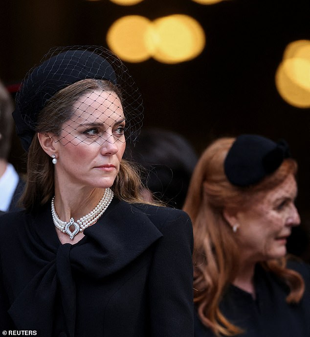 Ms James added: 'Kate's peripheral vision sees at first to be aware and wary of Fergie who is moving around behind and beside her. Her closed hand and her unsmiling expression signal no desire to engage or talk here, just keep the ex Royal in sight'