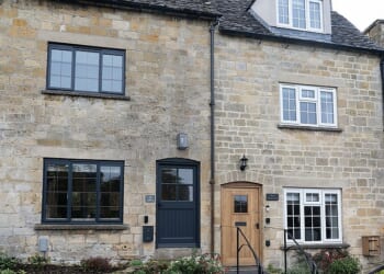 Pictured: One of the houses that has been installed with a black front door and black windows. The changes have not sat well with some residents who feel it is not in character with the area