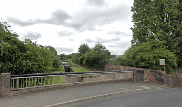 Three arrested for murder after woman's body is found in canal before waterway is drained