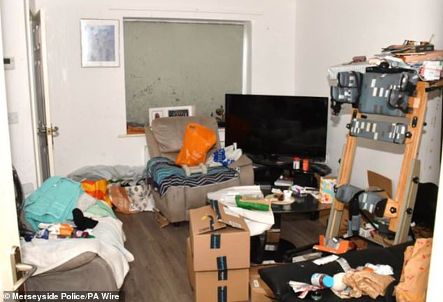 The lounge where Rudakubana slept, covered in rubbish such as Amazon delivery boxes