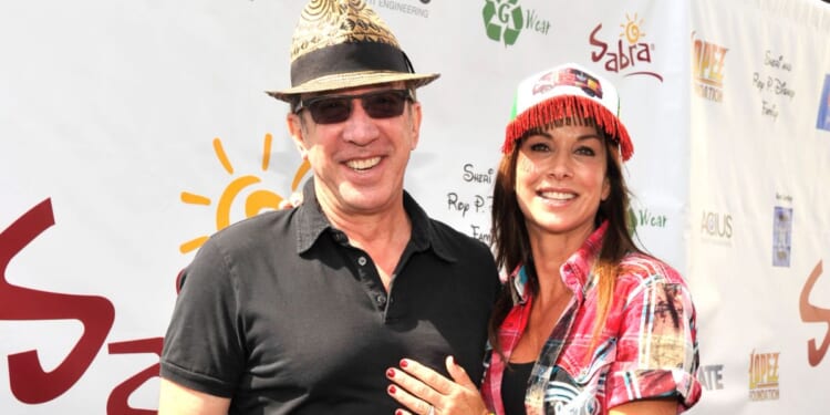 Tim Allen, left, and Debbe Dunning, right, attend the 7th Annual George Lopez Celebrity Golf Classic in Burbank, California, on May 5, 2014.