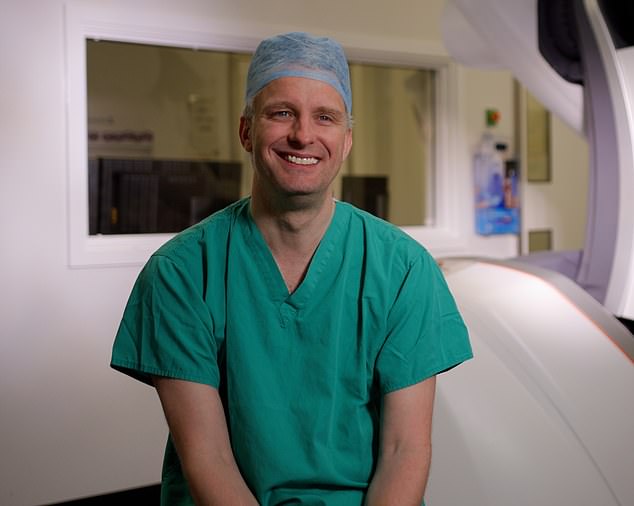 Newcastle have used the procedure to widen the artery in the leg of a man with peripheral artery disease, by putting in a balloon and then kept it open with a small tube, known as a stent. Pictured, James McCaslin, the consultant vascular surgeon who carried out the procedure