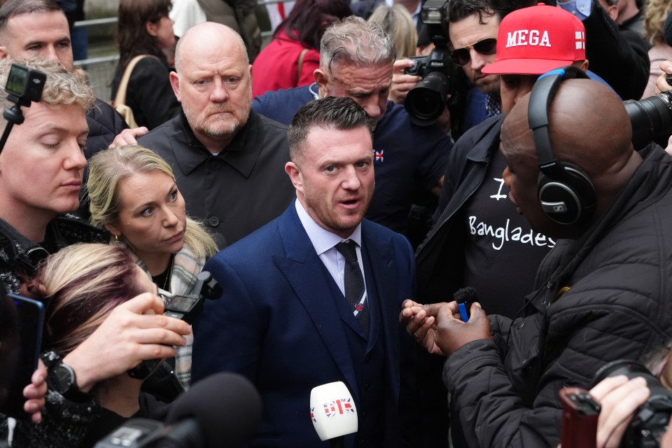 Stephen Yaxley-Lennon (Tommy Robinson) at Westminster Magistrates' Court, surrounded by reporters.