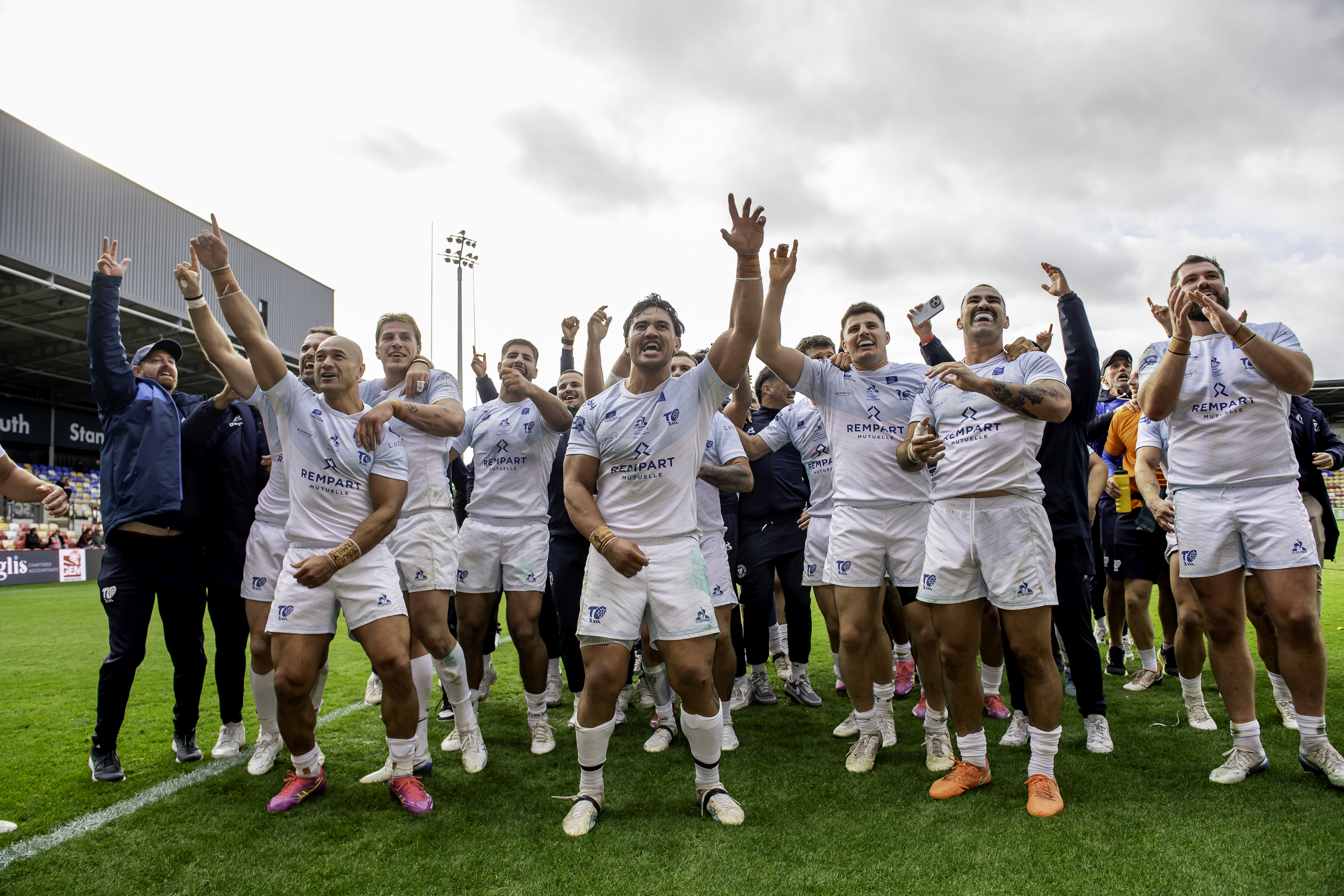 Toulouse Olympique players celebrating their victory over York Knights.